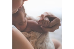 Image Mother holding baby female new born